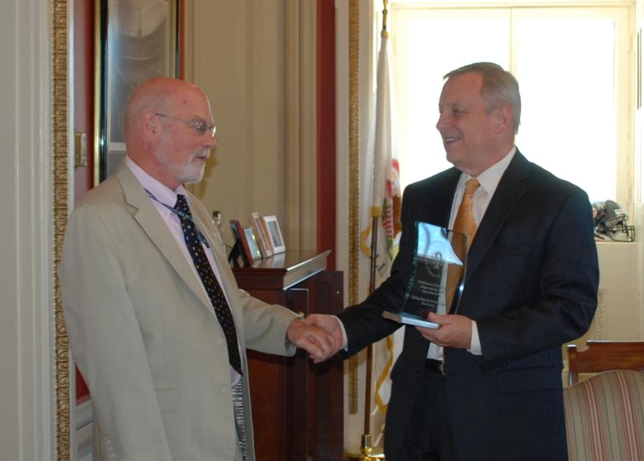 Congressional Hunger Center Executive Director Ed Cooney presented Senator Durbin with the Congressional Hunger Center Award.